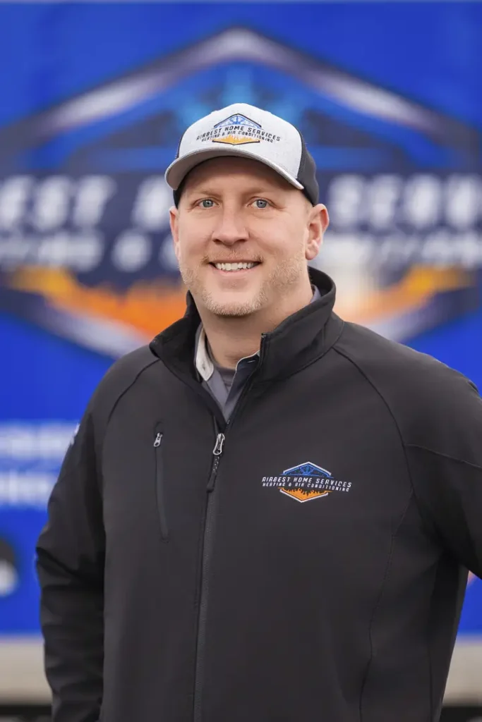 Person in branded jacket and cap