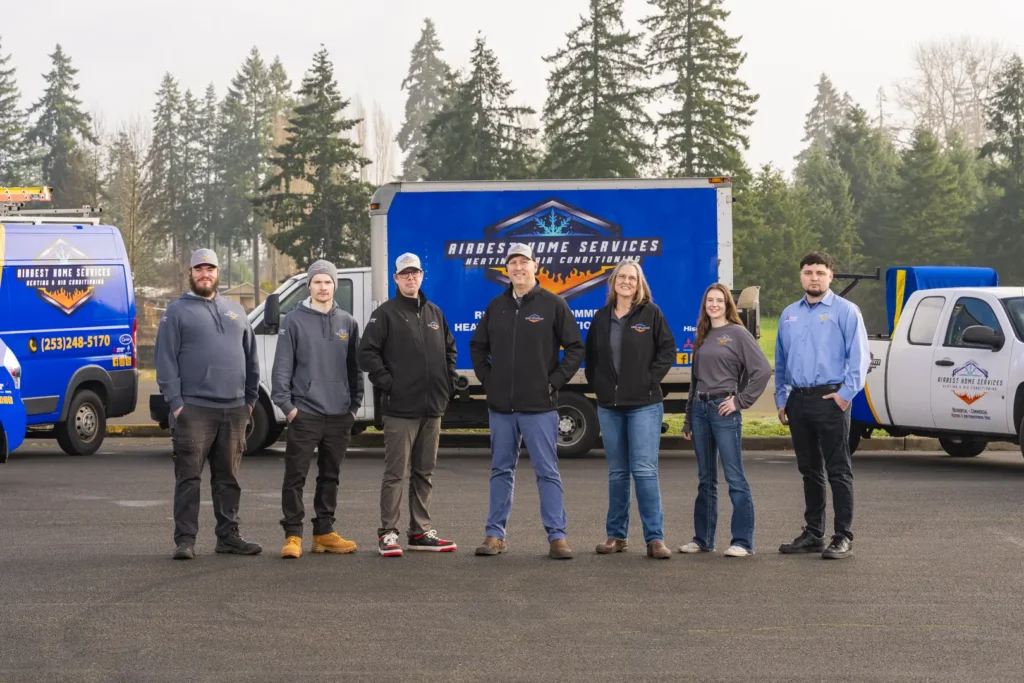 Group of workers in uniforms outdoors.