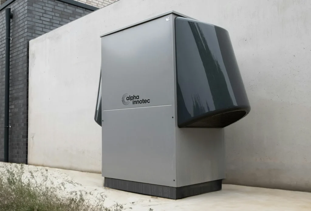 Modern heat pump unit outside building